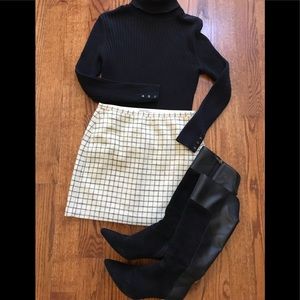 Adorable white and black mini skirt.